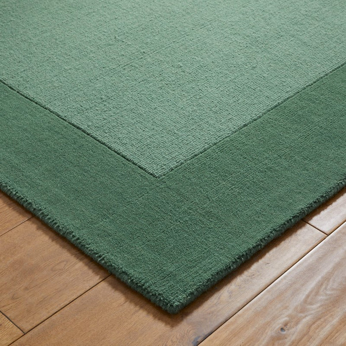 Colours Bordered Wool Rug in Green